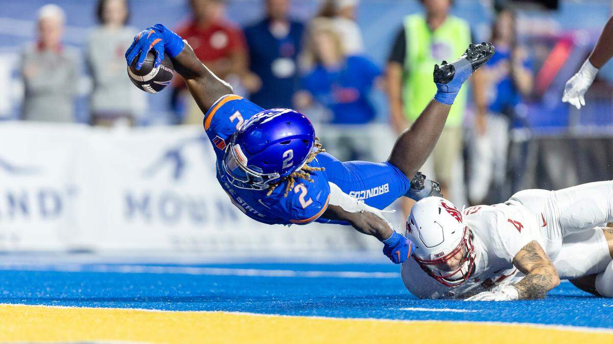Boise State running back Ashton Jeanty scores a touchdown in the fourth quarter against Washington State. Jeanty provided many great photos in a season full of highlights, and this picture came in second in the voting.