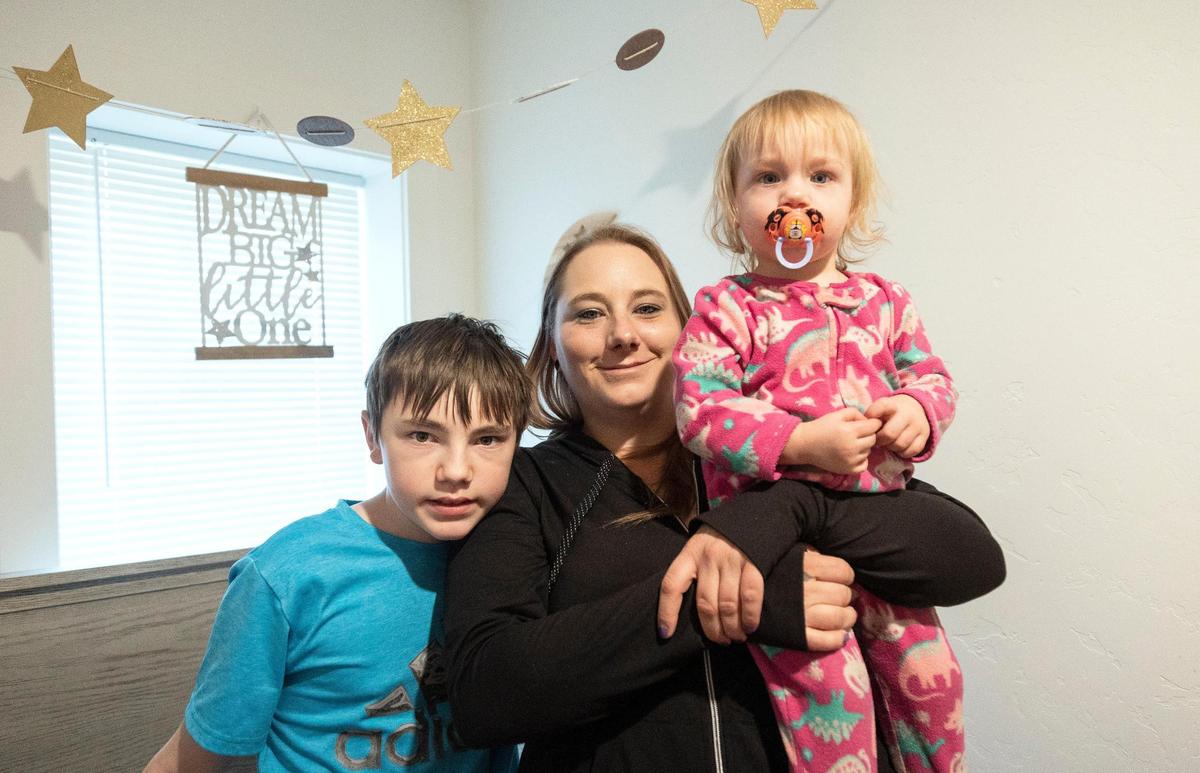 Katie Mengel, center, her son Kaydyn, left, and daughter Lorelei rent a duplex in Nampa. In search of affordable housing, Mengel has moved multiple times and endured hardships.