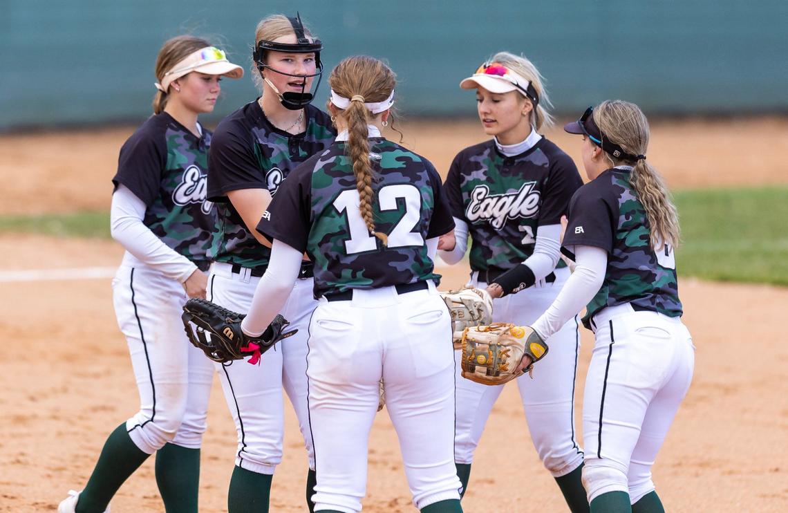 Eagle players meet at the pitcher’s mound last season.