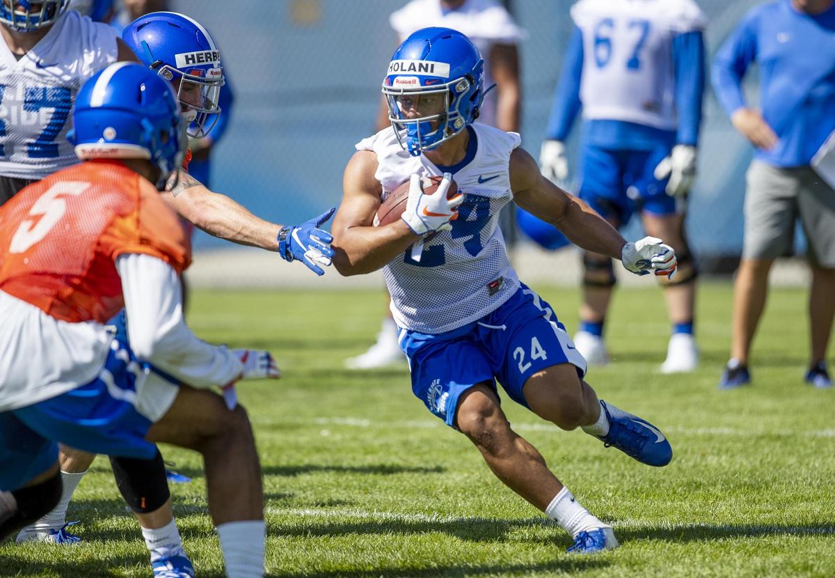 Boise State running back George Holani makes a cut in the backfield during the Broncos’ fall camp Friday, Aug. 2, 2019.