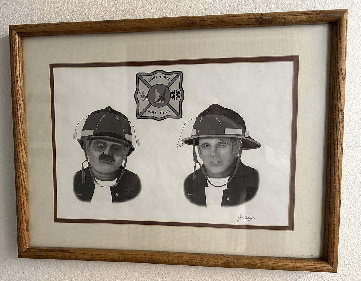 This portrait honoring Kuna firefighters Bill Buttram and Josh Oliver hangs in the front hallway of the Kuna fire station, across from the main entrance, greeting everyone who enters.
