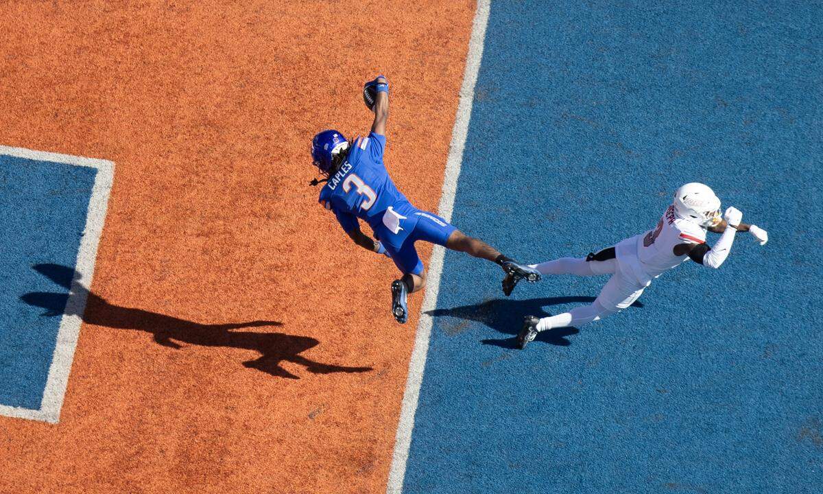 Boise State wide receiver Latrell Caples dives into the end zone for a 7-yard touchdown reception past UNLV safety Jaheem Joseph in the team’s big win on Oct. 18.