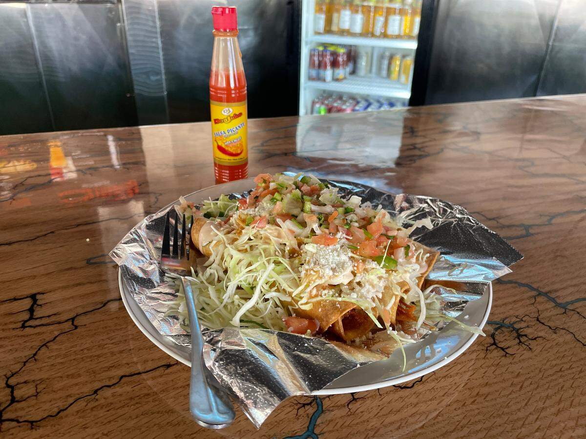 Tacos Hondurenos ($13) are among the menu options.