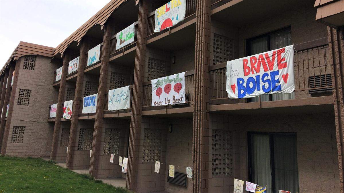 Signs with positive words and messages adorn balconies in April at the Cottonwood Suites Boise Riverside Downtown hotel, on the Greenbelt just north of Fairview Avenue, amid the coronavirus pandemic, when hotels were largely empty. 