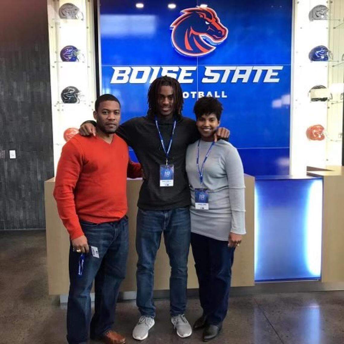 Boise State wide receiver Stefan Cobbs poses with his parents, Stefan Sr. and Jennifer, during a visit to the university while he was being recruited.