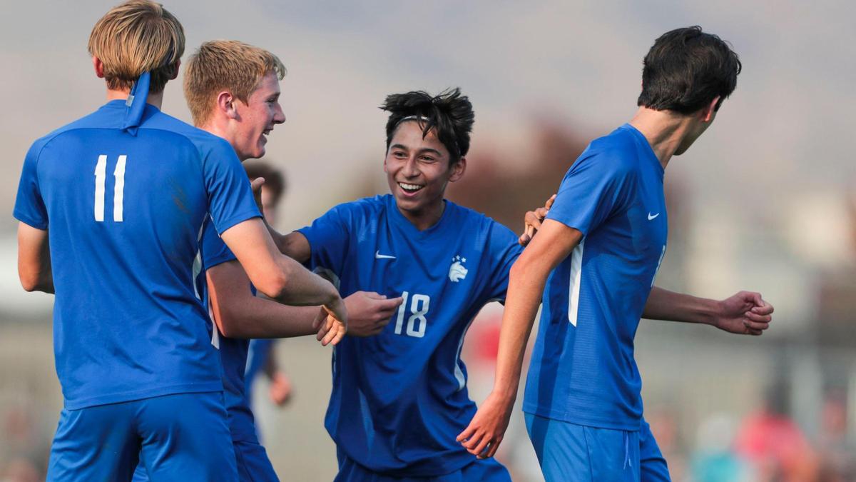 Timberline sophomore Jeremiah Moreno and teammates celebrate his 29th-minute goal against Boise on Monday. The game-winning goal clinched the Wolves an undefeated regular season and the top seed at the district tournament.