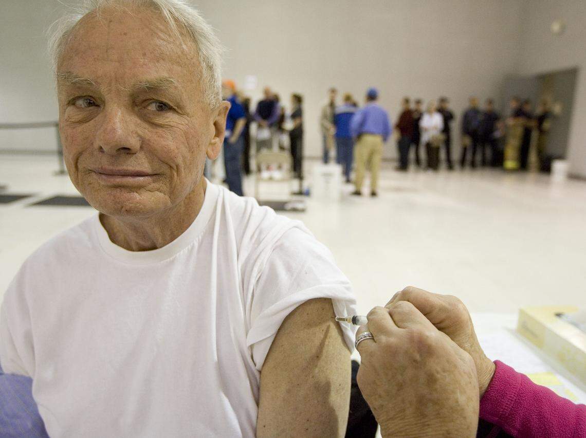 Dr. Bryan Stone, M.D., a physician at Valley Family Healthcare in Emmett, receives his H1N1 virus vaccination shot in Boise in this October 2009 Idaho Statesman file photo. Hundreds of health occupation workers were given the first line of available swine flu shots provided by Idaho Central District Health Department.