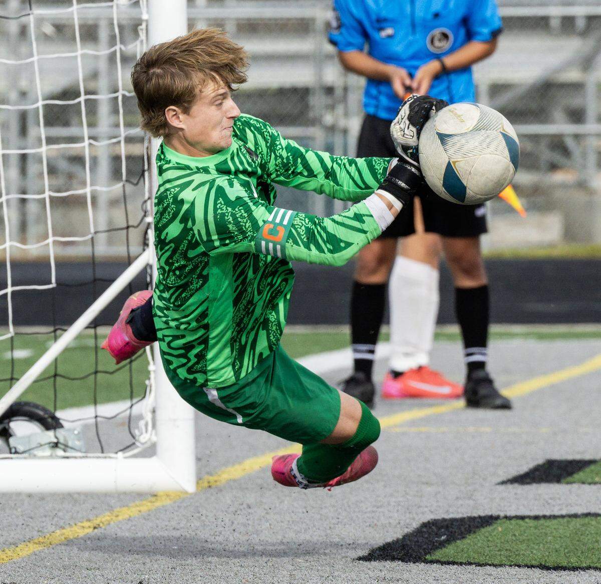 Borah goalkeeper Christian Griffith deflects a Boise penalty kick in overtime during the 6A boys soccer state semifinals at Eagle High School in Eagle, Thursday, Oct. 23, 2025.