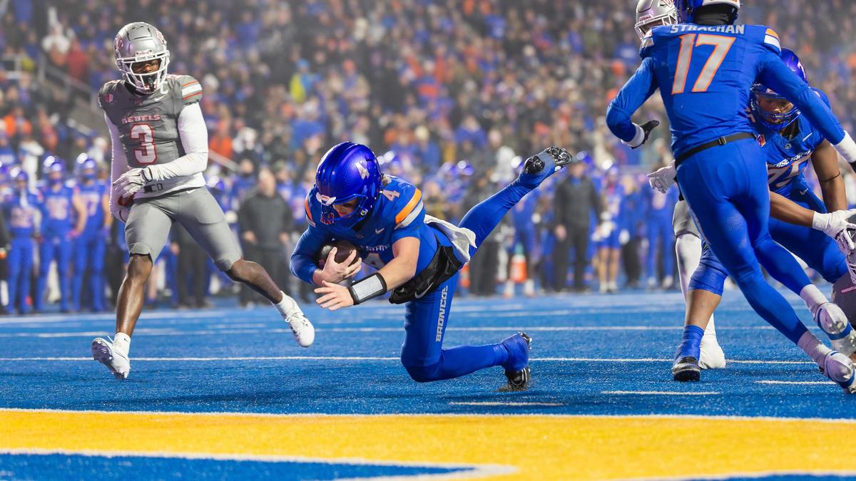 Boise State quarterback Maddux Madsen dives into the end zone for a second-quarter touchdown that gave the Broncos a 14-0 lead. They went up 21-0 in the first half of Friday night’s Mountain West championship game.