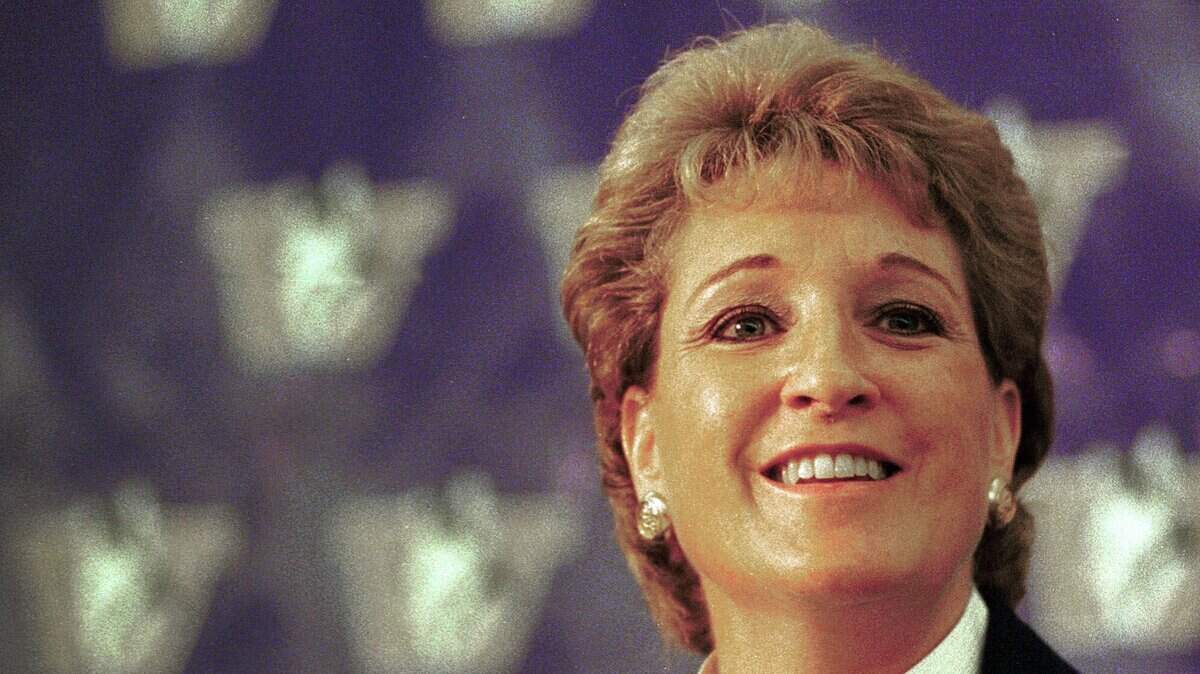 In this file photo, University of Washington women’s basketball coach June Daugherty speaks to the media on Oct. 27, 1998. Daugherty, who also coached at Boise State and Washington State, died Aug. 2 at the age of 64.