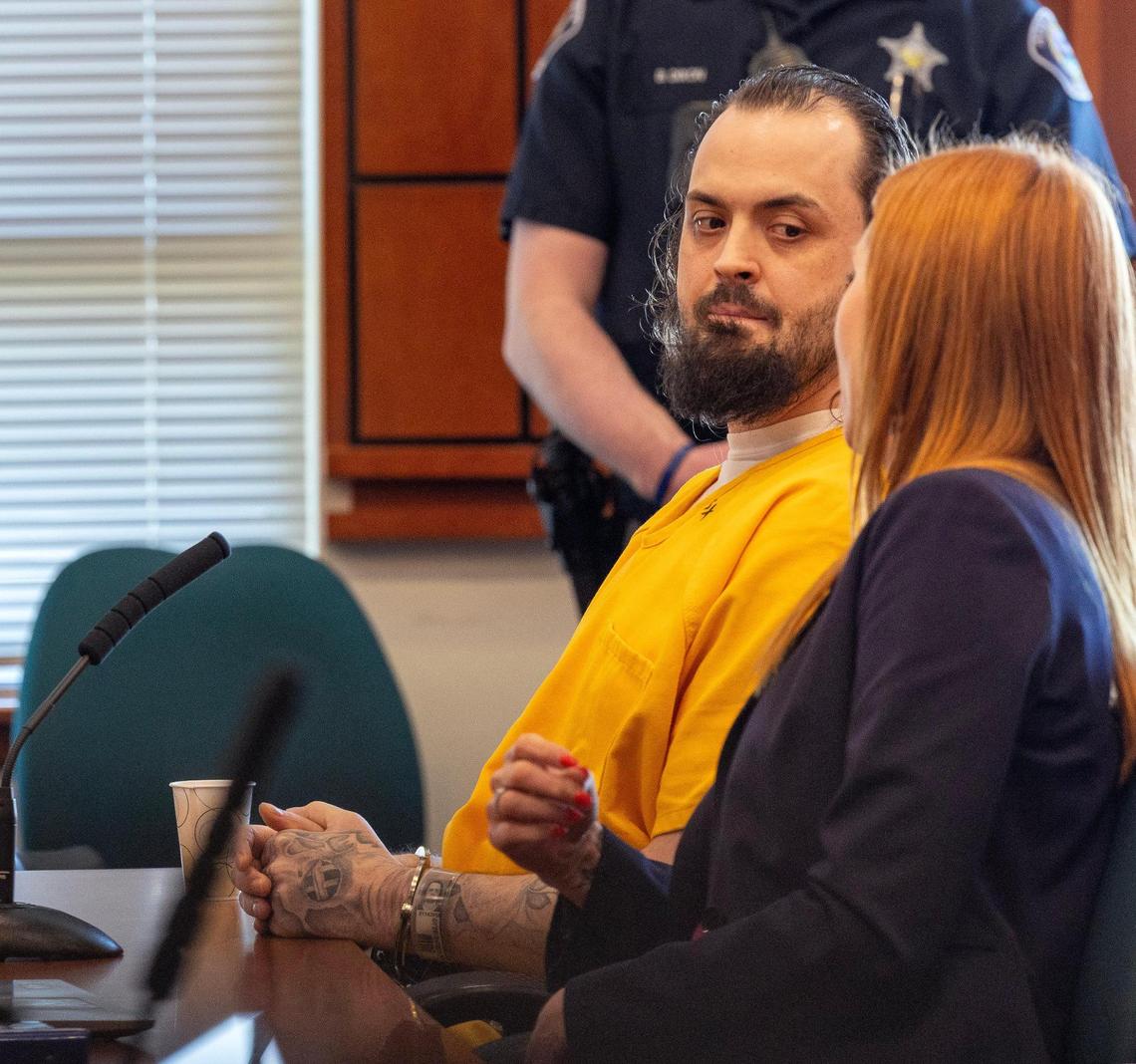 Public defender Amy Smith speaks with her client James Johnson during his sentencing at the Ada County Courthouse, for the 2023 murder of Milo Warnock. Johnson and Warnock were cellmates at the Idaho State Correctional Center.