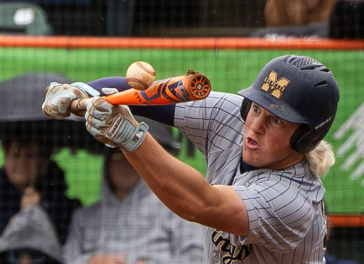 A photo of Middleton junior Drew Holman bunting a baseball won first place for Sports News Photography.