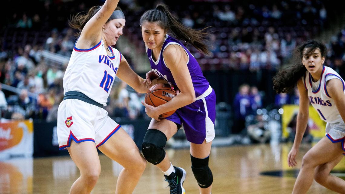 Rocky Mountain’s Cianna Legaspi is fouled while dribbling against Coeur d’Alene last season at the state tournament.