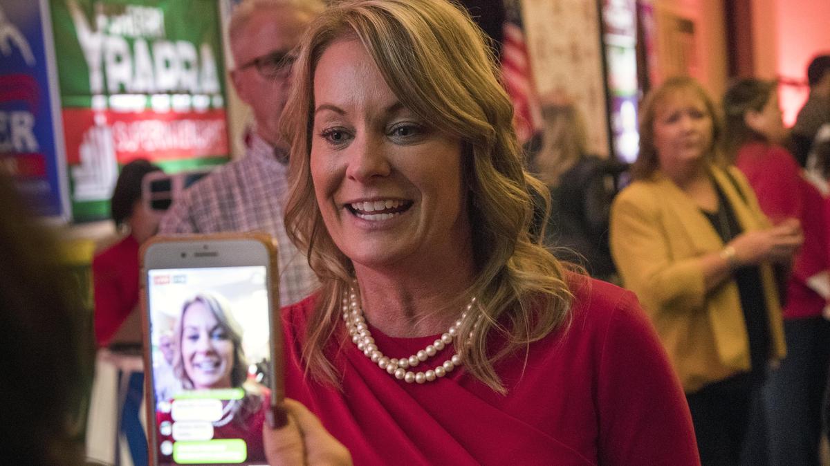 Sherri Ybarra, superintendent of public instruction, talks live on a cellphone interview while attending the Republican election night party Tuesday, Nov. 6, 2018, at the Riverside Hotel in Garden City.