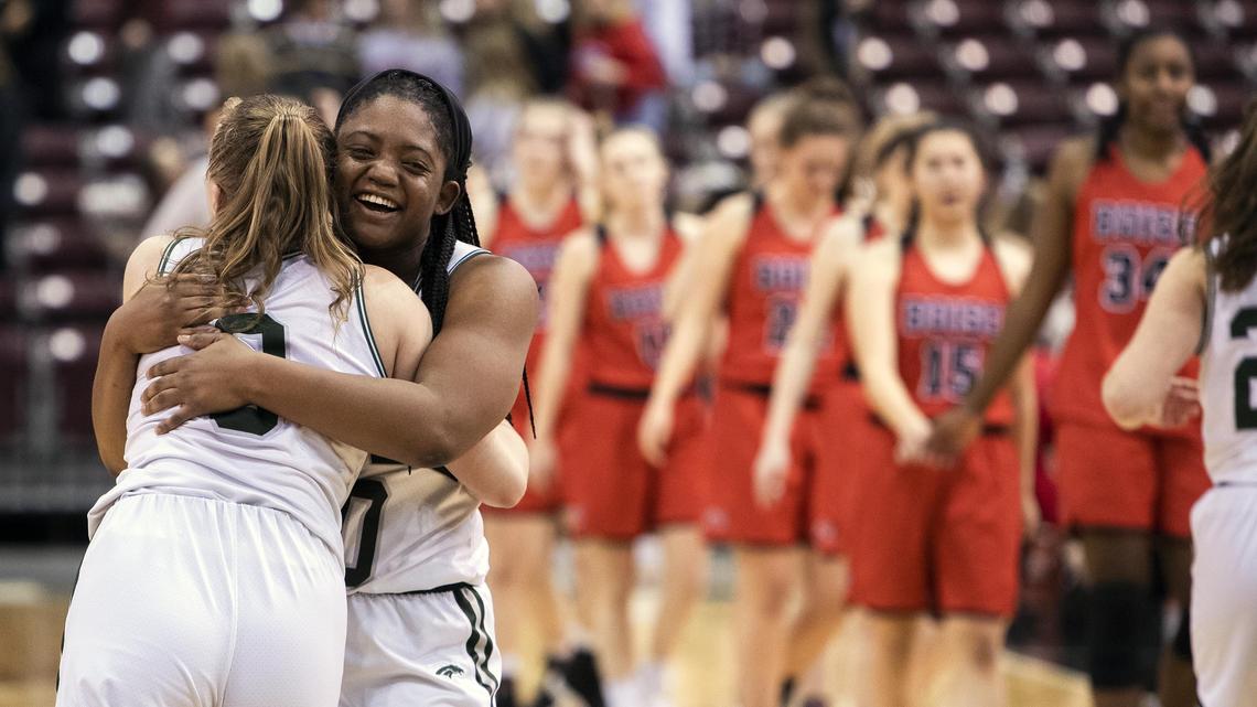 Eagle seniors Jaimee McKinnie, facing, and Meghan Boyd embrace after defeating Boise 61-55 in the state 5A girls basketball semifinals Friday, Feb. 15, 2019 at Ford Idaho Center in Nampa.