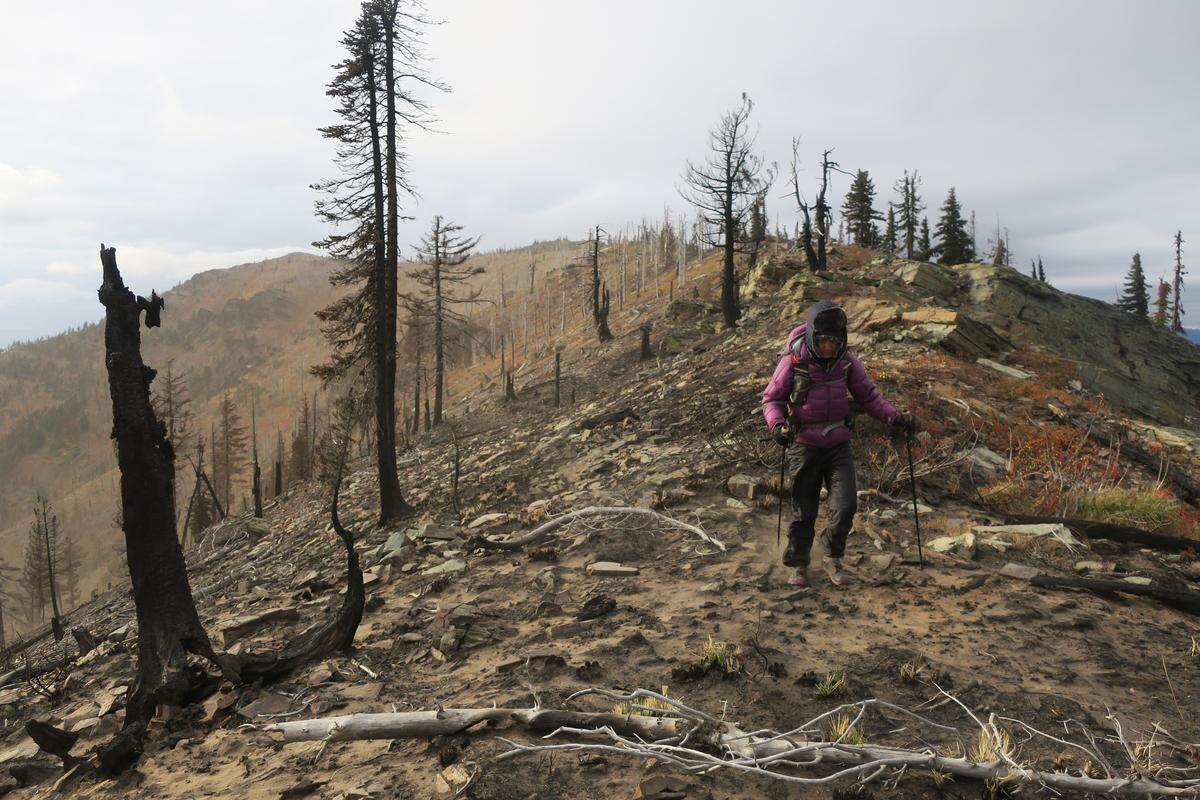 Kathy Vaughan hikes a ridge at the Idaho-Montana state line. Kathy and her husband, Ras, created a 2,600-mile trail around the Northwest that they named the UltraPedestrian North Loop, made by connecting the Idaho Centennial Trail, the Oregon Desert Trail, the Pacific Crest Trail and the Pacific Northwest Trail.