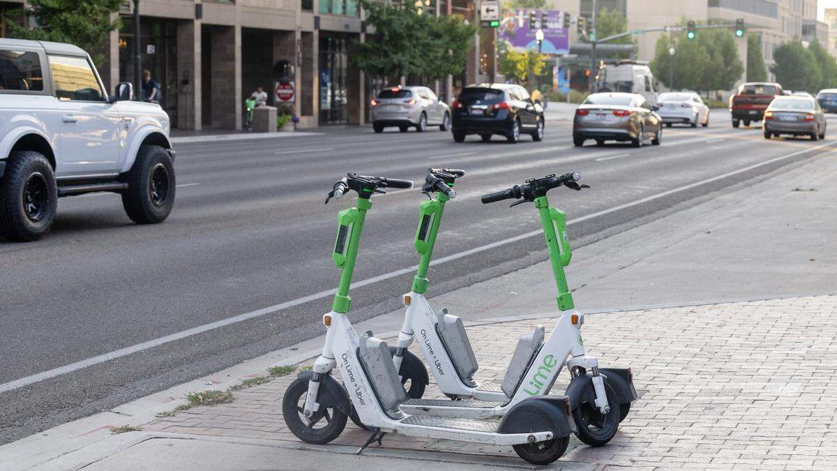 Lime e-scooters are parked on Front Street in Boise, Saturday, August. 23, 2025.