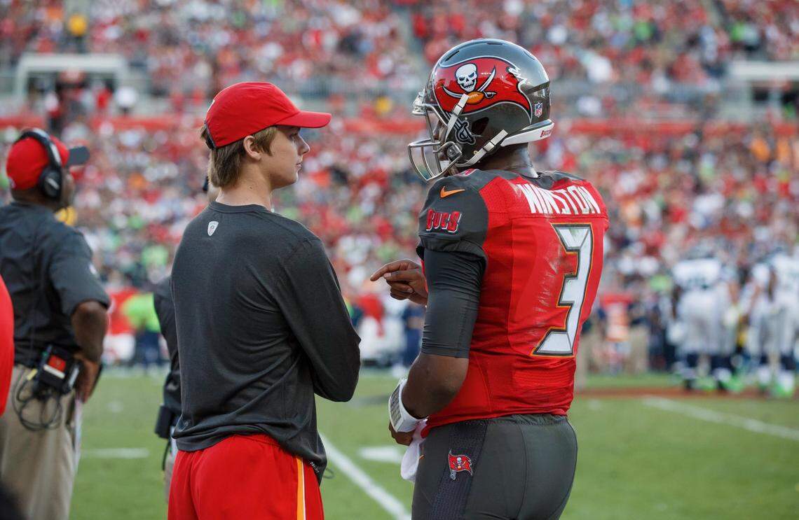 Boise State wide receiver Davis Koetter (left) speaks with former Tampa Bay Buccaneers quarterback Jameis Winston during a game. Koetter’s father, Dirk, spent the 2015 season as the Buccaneers’ offensive coordinator and the three seasons that followed as head coach.
