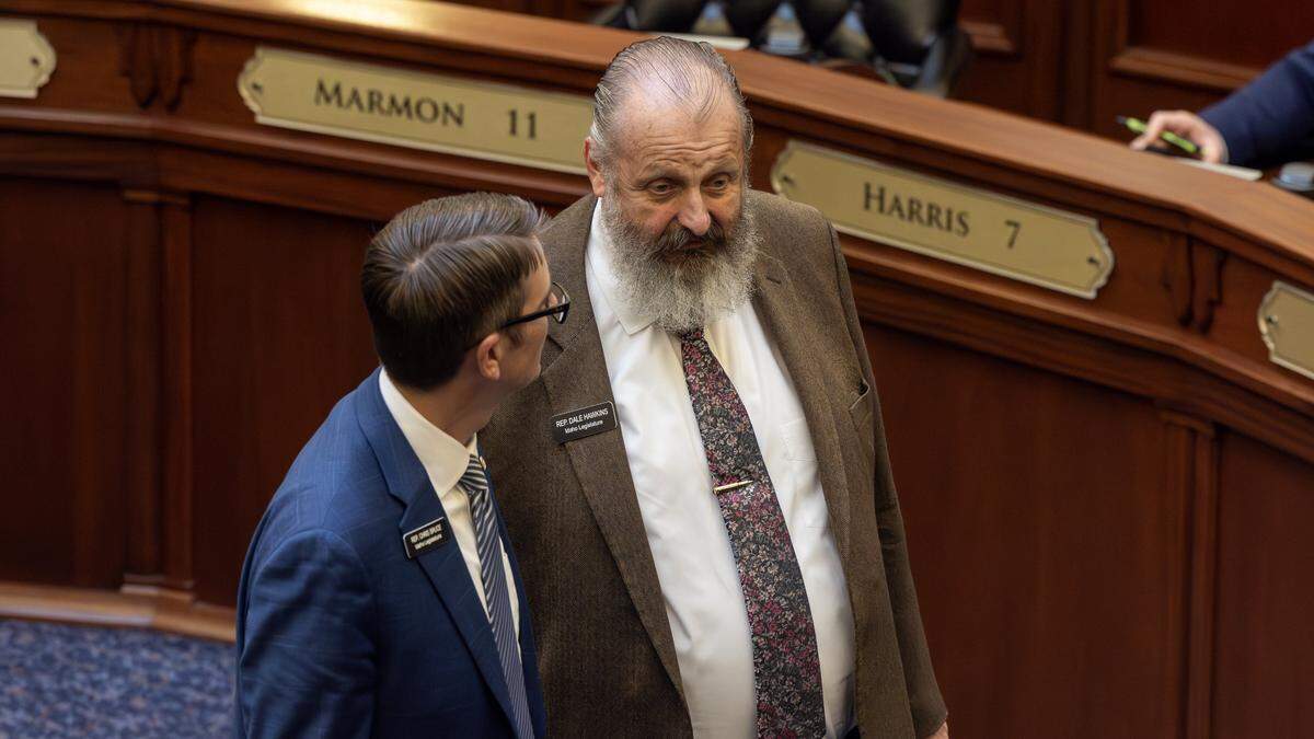Rep. Chris Bruce and Rep. Dale Hawkins talk during a break in the House session at the Idaho Capitol, Thursday, April 2, 2026.