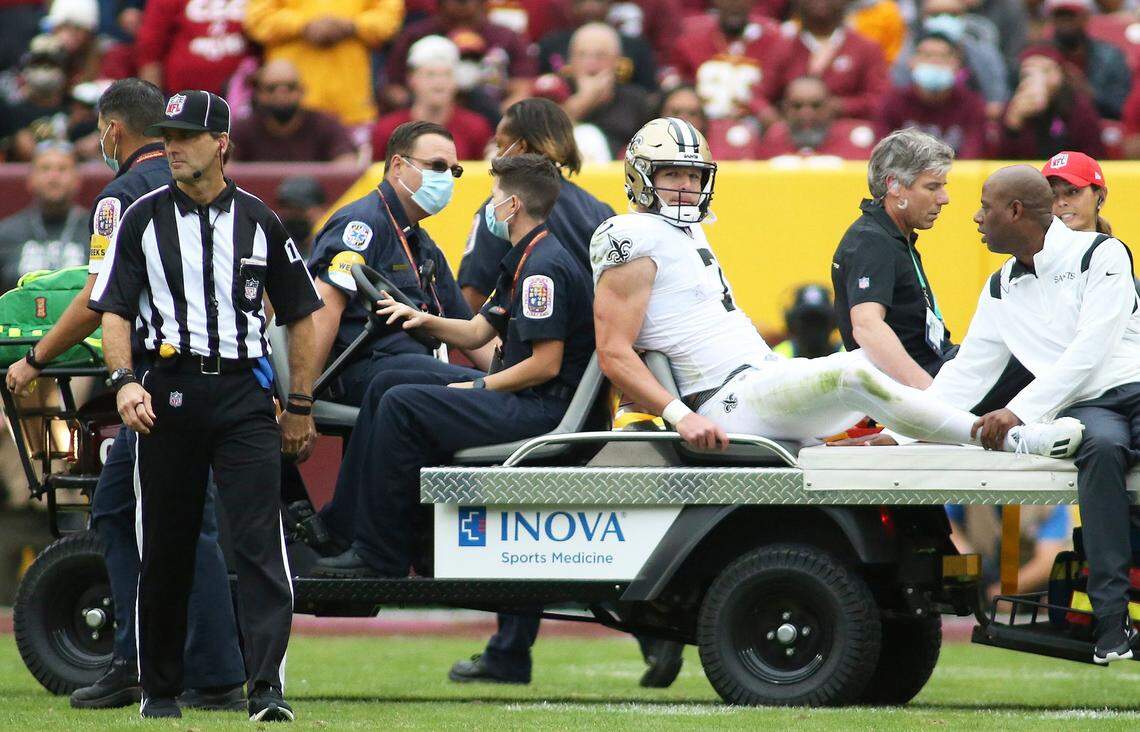 New Orleans Saints quarterback Taysom Hill is carted off the field after sustaining a concussion against the Washington Football Team on Oct. 10 in Landover, Maryland.