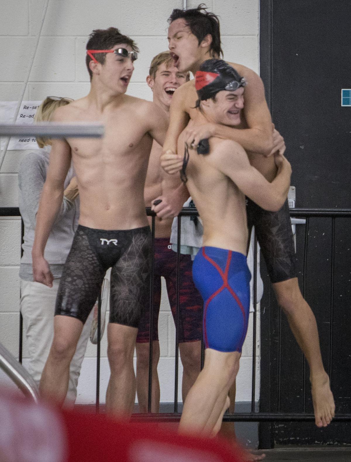 The Boise 200-yard medley relay team celebrates its win at the 5A state swimming championships at the West YMCA on Saturday.