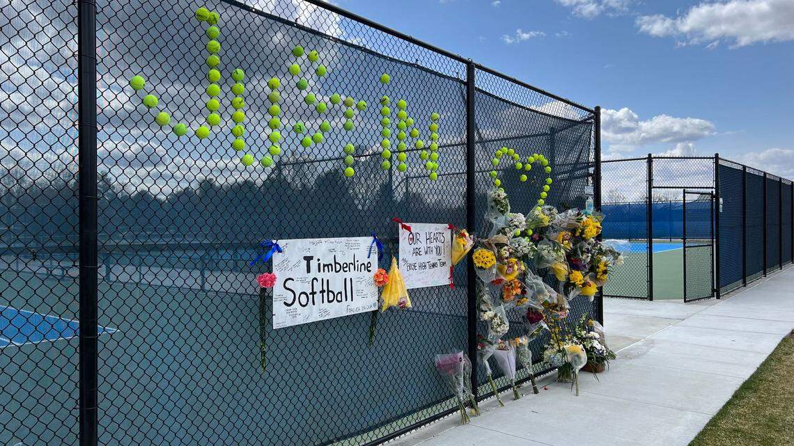 A makeshift memorial has been set up at the Timberline High School tennis courts for Justin Smith, who collapsed Monday at practice and died.