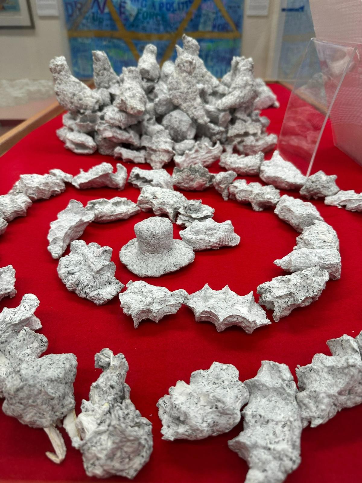 Washing Hate, from artist Billie Lynn, of Coral Gables, Florida, features pages of The Creativity Movement’s books washed in soap and water until they began to dissolve and were re-formed into small sculptures.