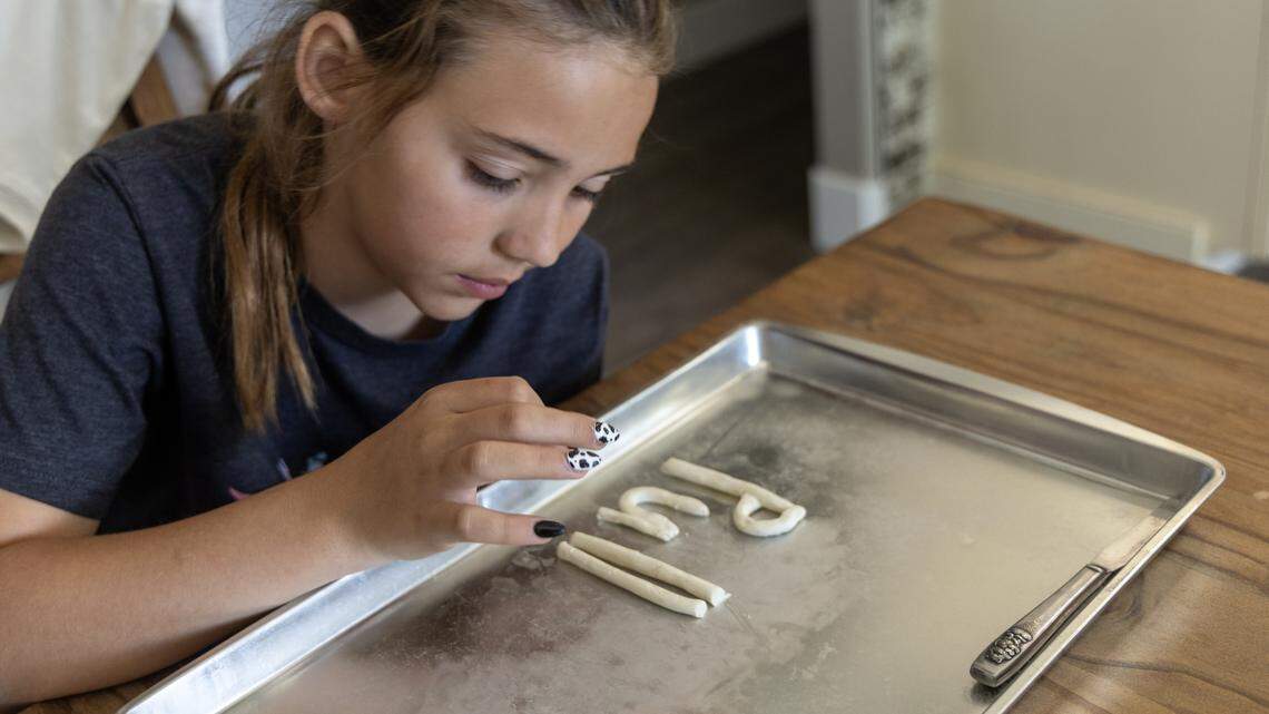 Kali Larsen, who has dyslexia and struggles with reading and writing, uses clay with her private tutor to practice spelling.