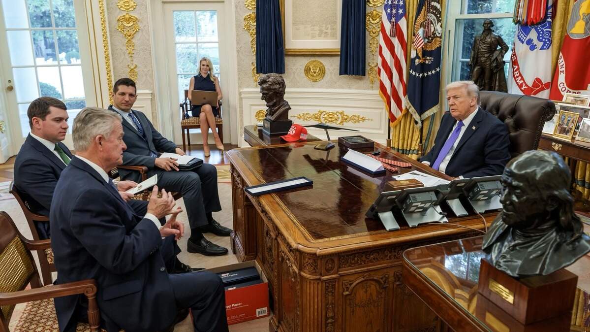 Idaho Gov. Brad Little, left, met with President Donald Trump, right, and members of his staff in the White House’s Oval Office on Oct. 22, 2025, in Washington, D.C. During the visit, Little gifted the president a box of custom Idaho potato ties.