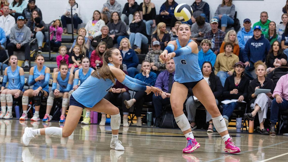 Skyview junior outside hitter Bellamie Beus, right, passes the ball in a match against Owyhee in the 6A District Three Tournament volleyball championship game at Capital High School.