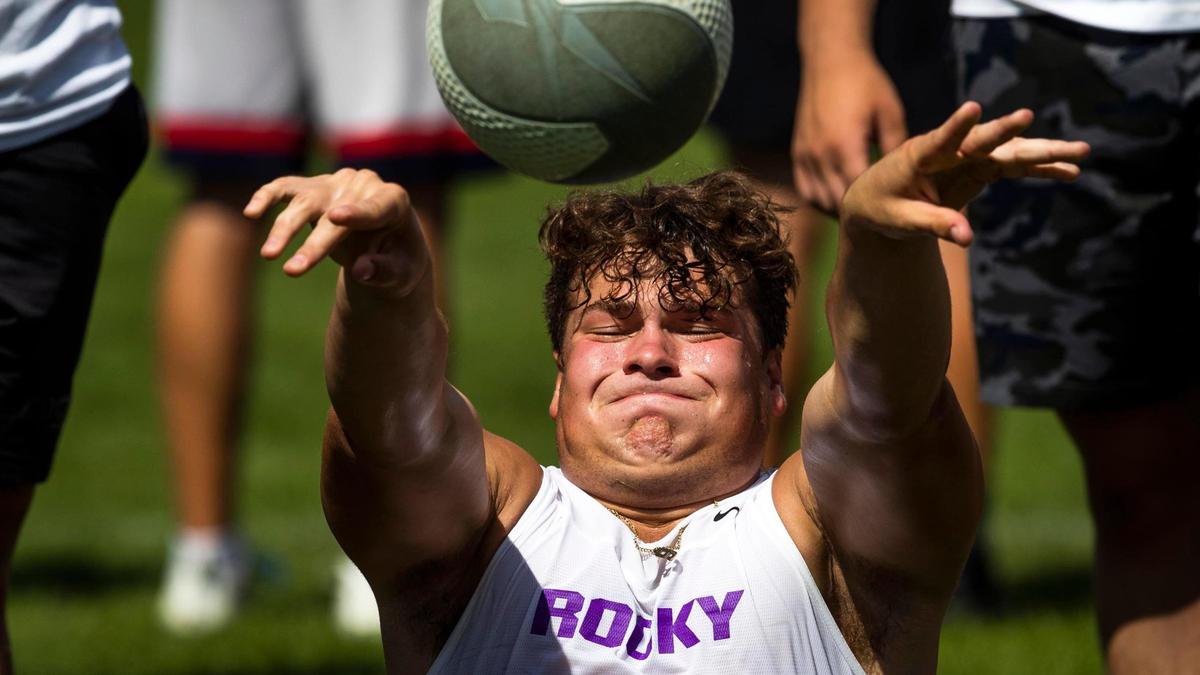 Rocky Mountain’s Kade Steadman, an Air Force commit, tosses a medicine ball during the Potato Bowl 7-on-7 Tournament’s lineman challenge Saturday at the Optimist Youth Sports Complex in Boise.