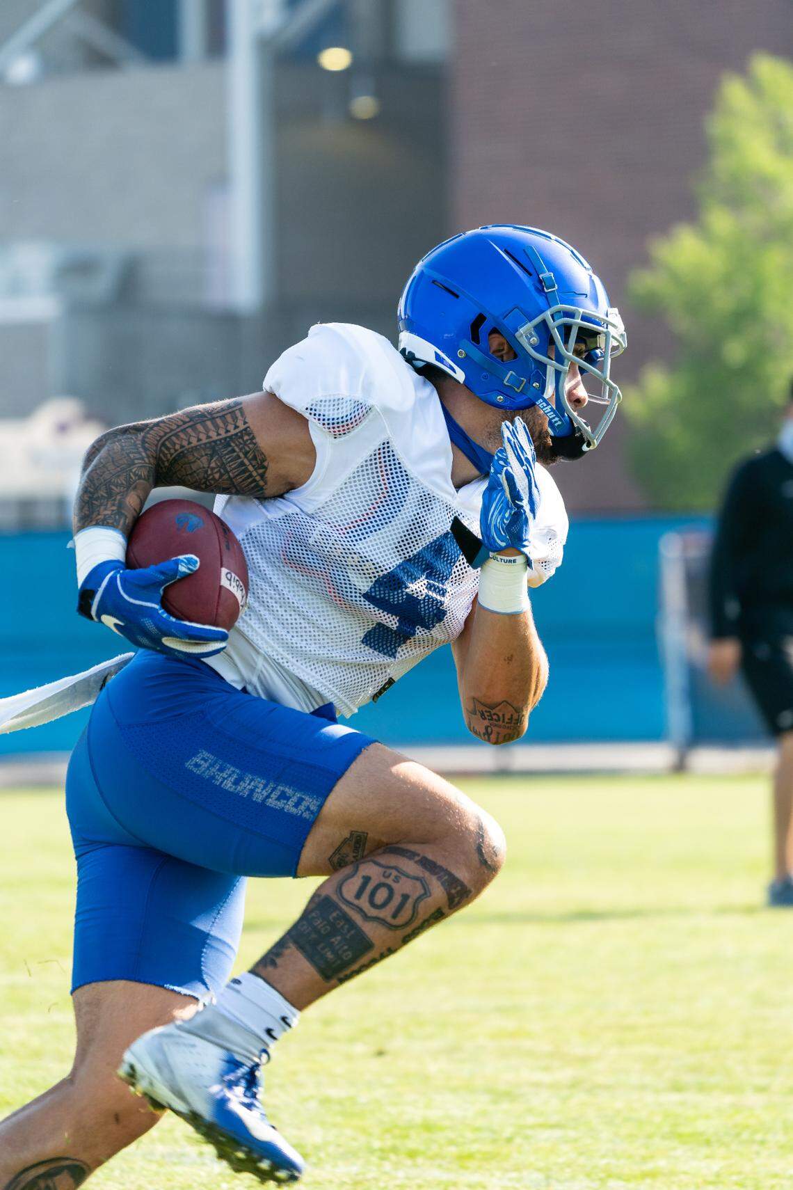 Boise State running back Cyrus Habibi-Likio carries the ball during fall practice. He joined the Broncos this summer after transferring from Oregon.