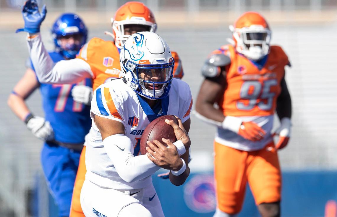Boise State quarterback Taylen Green keeps the ball during their spring game held on Saturday, April 9, 2022, at Albertsons Stadium. DEFENSE: 98 Herbert Gums nose tackle 95 Divine Obichere defensive tackle 99 Scott Matlock defensive tackle 0 JL Skinner safety 4 Sam Vidlak safety 15 Deven Wright defensive lineman 26 Caleb Biggers cornerback 33 Cortez Hogans OFFENSE: 19 Hank Bachmeier QB 24 George Holani RB 10 Taylen Green QB 2 Ashton Jeanty RB 5 Stef Cobbs WR 81 Austin Bolt WR