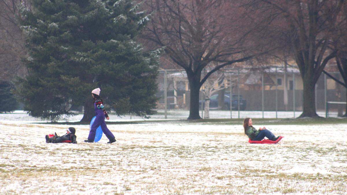 Children sled at Camel’s Back Park in the North End on New Year’s Day.