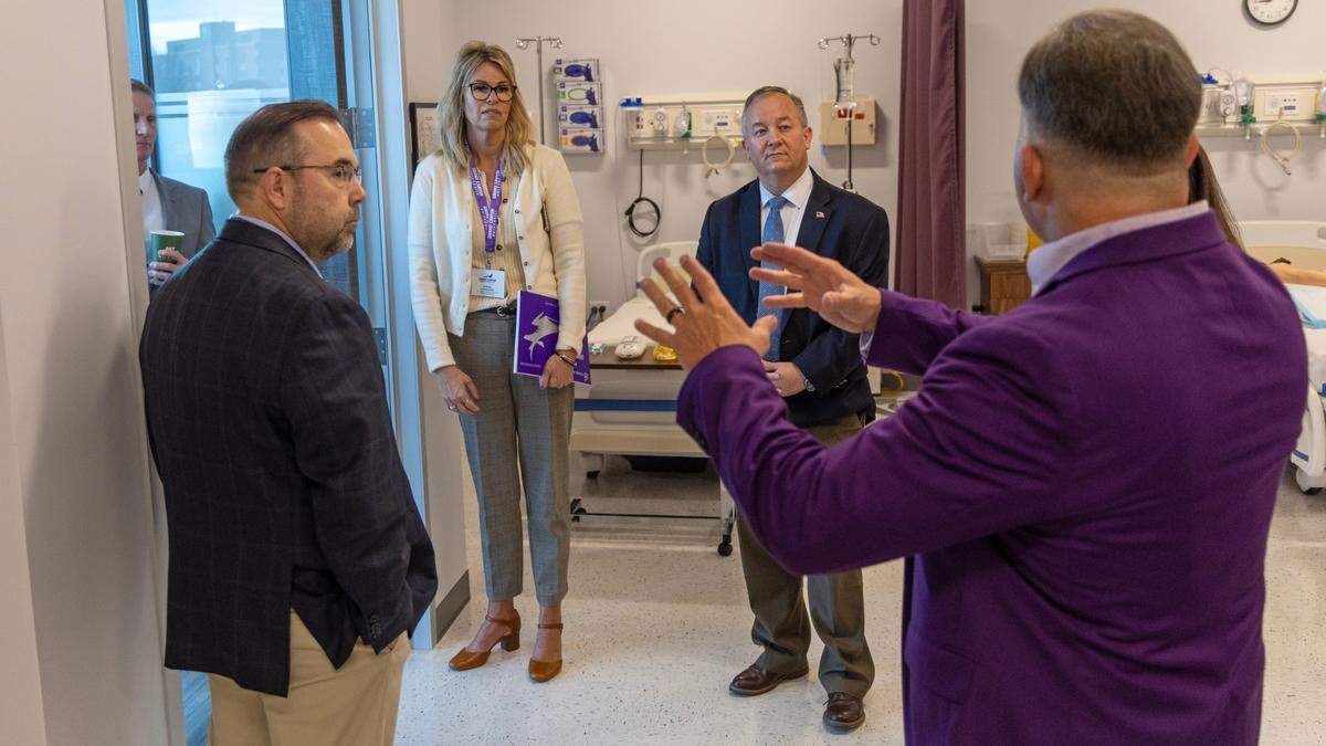 Debbie Critchfield, Idaho superintendent of public instruction, and Meridian Mayor Robert Simison take a tour of the clinical skills lab at Grand Canyon University’s new Meridian site.