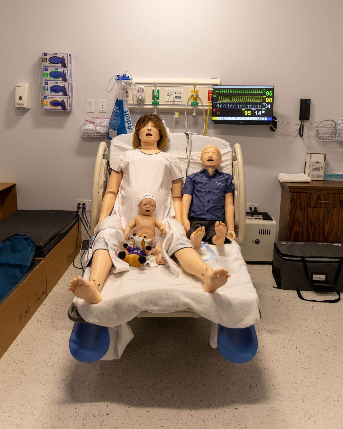 Mannequin-like patients sit in a simulation lab at GCU in Meridian, their chests rhythmically rising and falling. These simulated patients can cough, cry, and receive intravenous lines, or IVs. The mother mannequin can give birth.