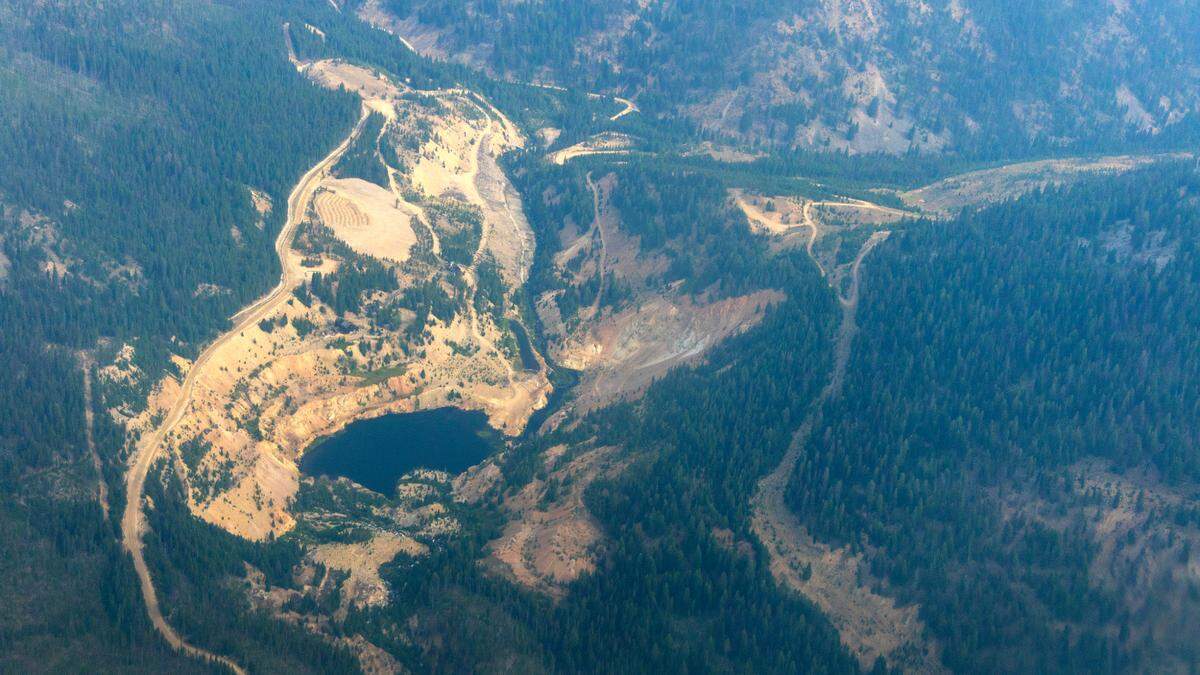 The Yellow Pine Pit, as seen aboard an EcoFlight, would be mined again as part of three open-pit mines under a plan proposed by Perpetua Resources. Mining in the Stibnite area dates to the late 19th century.
