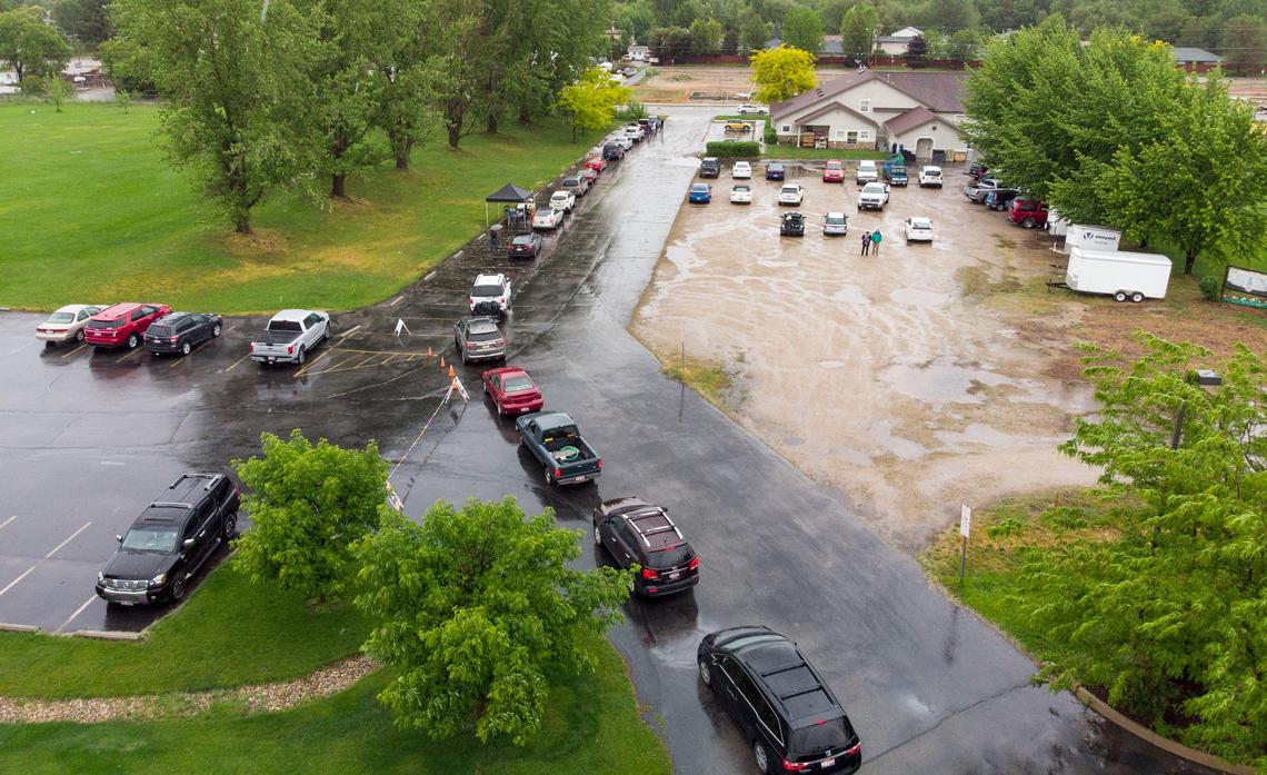 A line of cars waits outside the Vineyard food pantry in Garden City on Wednesday. “When the coronavirus initially broke out, we saw about a 100% increase in our numbers for about a month,” Samuel Burns, benevolence director for Vineyard Boise Christian Fellowship, said.