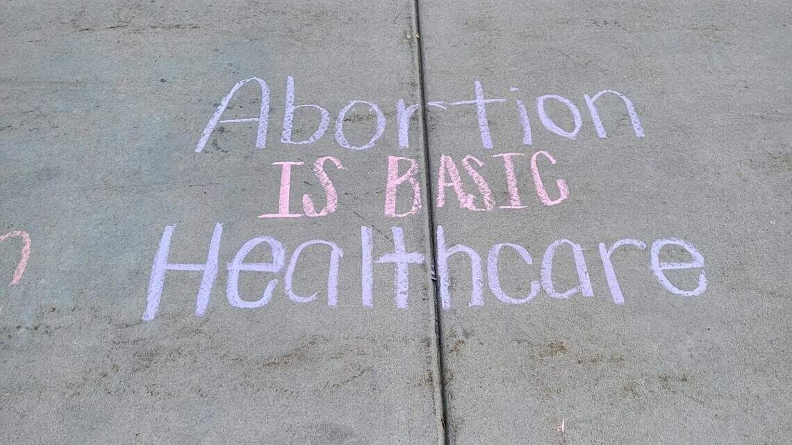 Chalk on a sidewalk at Idaho Capitol led to police assault, abortion rights group claims