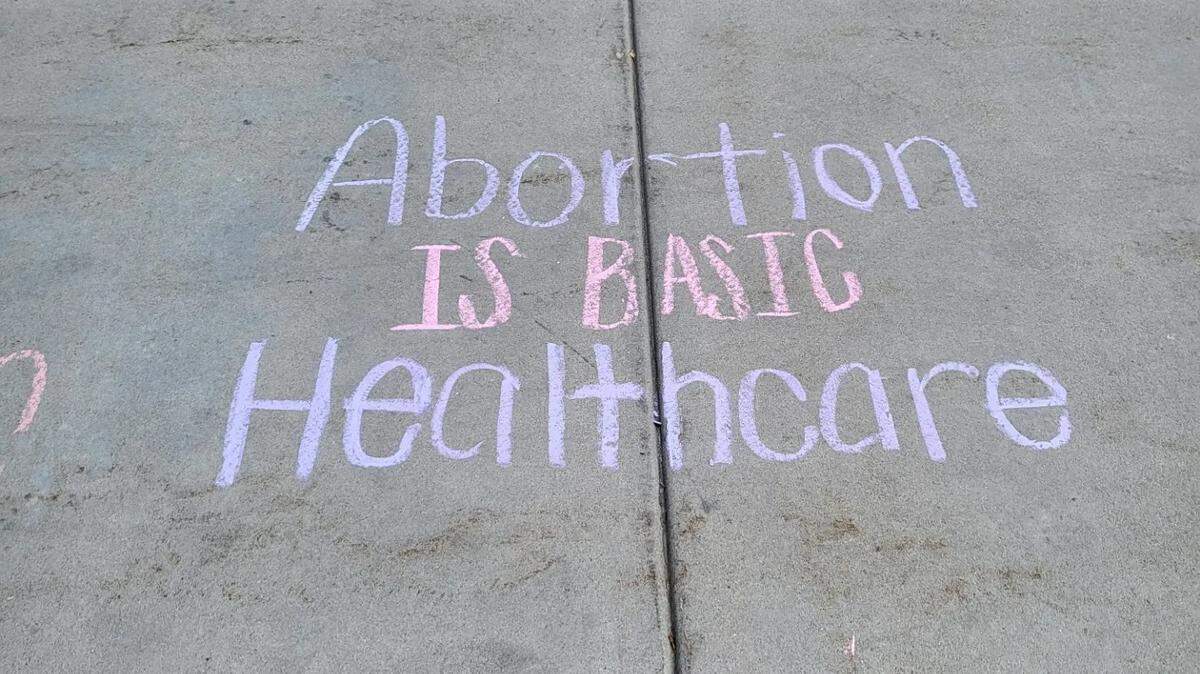 Idaho Abortion Rights members wrote in chalk outside the Idaho Capitol in Boise prior to demonstrations there in June.