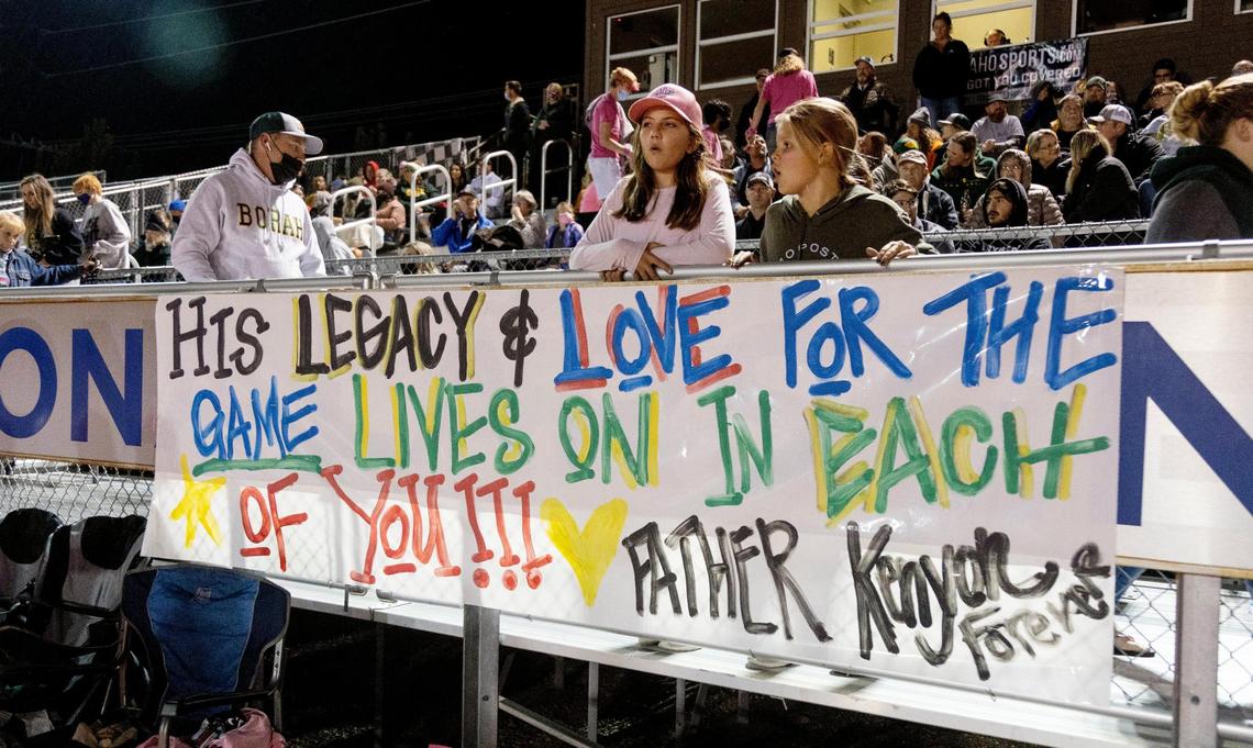 A banner hangs along the home bleachers honoring Quane Kenyon, a longtime Borah assistant coach who died Sunday.