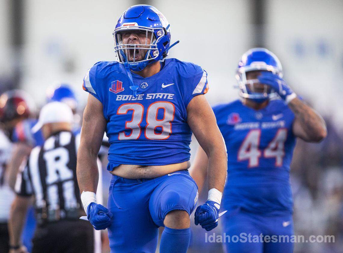 Boise State edge Demitri Washington gets the crowd at Albertsons Stadium energized after the defense sacked San Diego State quarterback Braxton Burmeister, Friday, Sept. 30, 2022 in Boise.