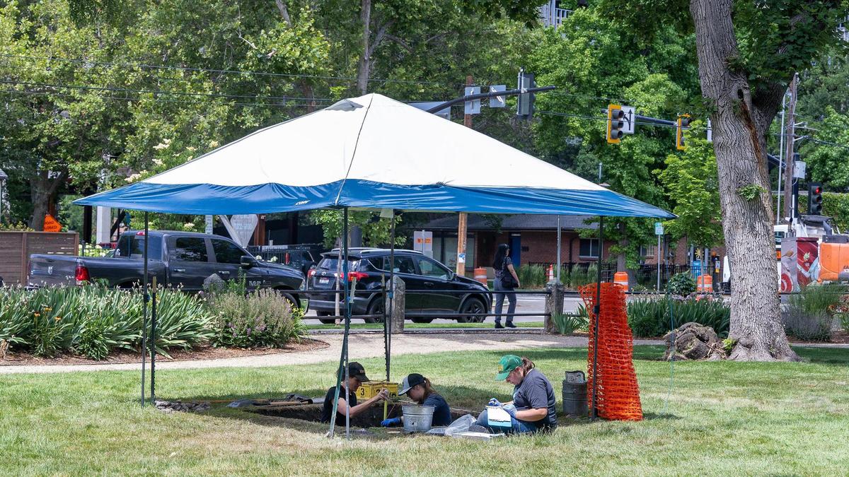 College students and volunteers work conduct archaeological dig at the second area of interest outside of the State Historic Preservation Office.