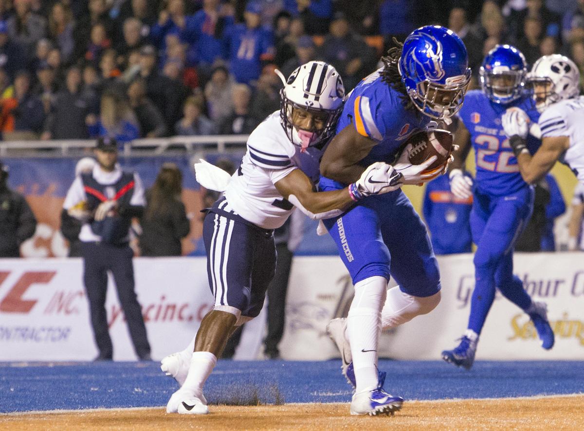 Boise State wide receiver A.J. Richardson (7) scores on a touchdown pass defended by Brigham Young defensive back Michael Shelton (18) Saturday Nov. 3, 2018 at Albertsons Stadium in Boise.