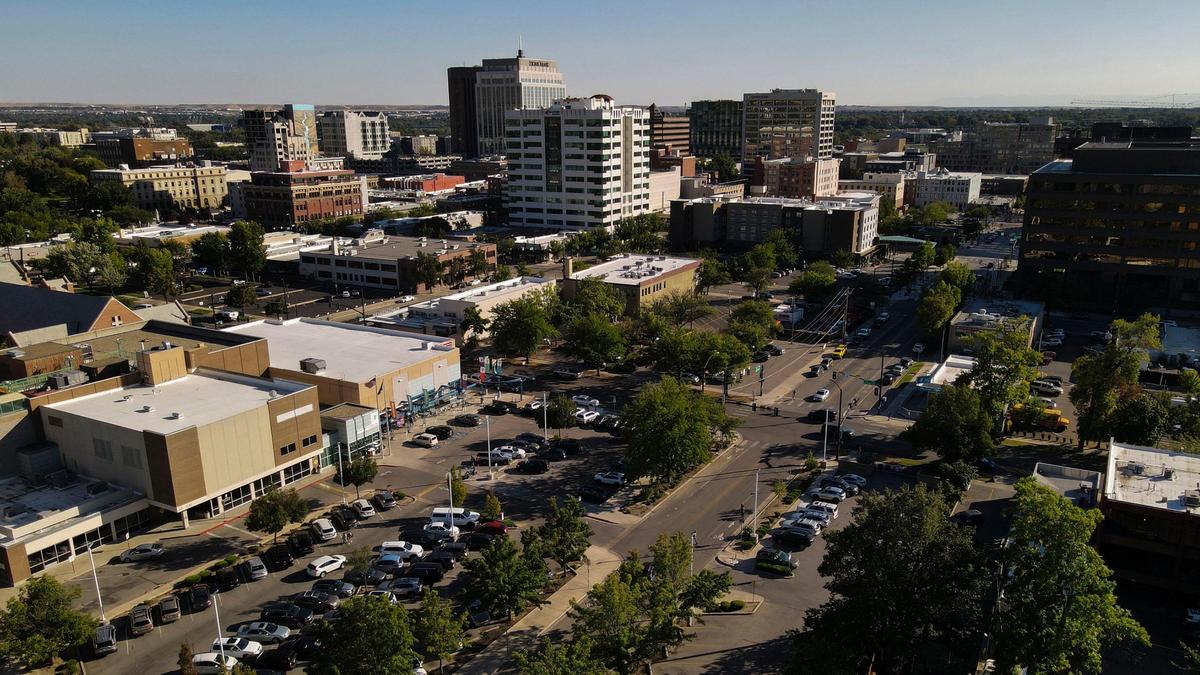 Developers are planning to redevelop multiple blocks of land in downtown Boise just south of Boise High School, which is just outside of this south-looking photo below the lower left corner. The project would move the YMCA, center left, a block south across State Street, and it would construct two buildings, one 15-story and the other seven-story, for hundreds of apartments and ground-floor businesses.