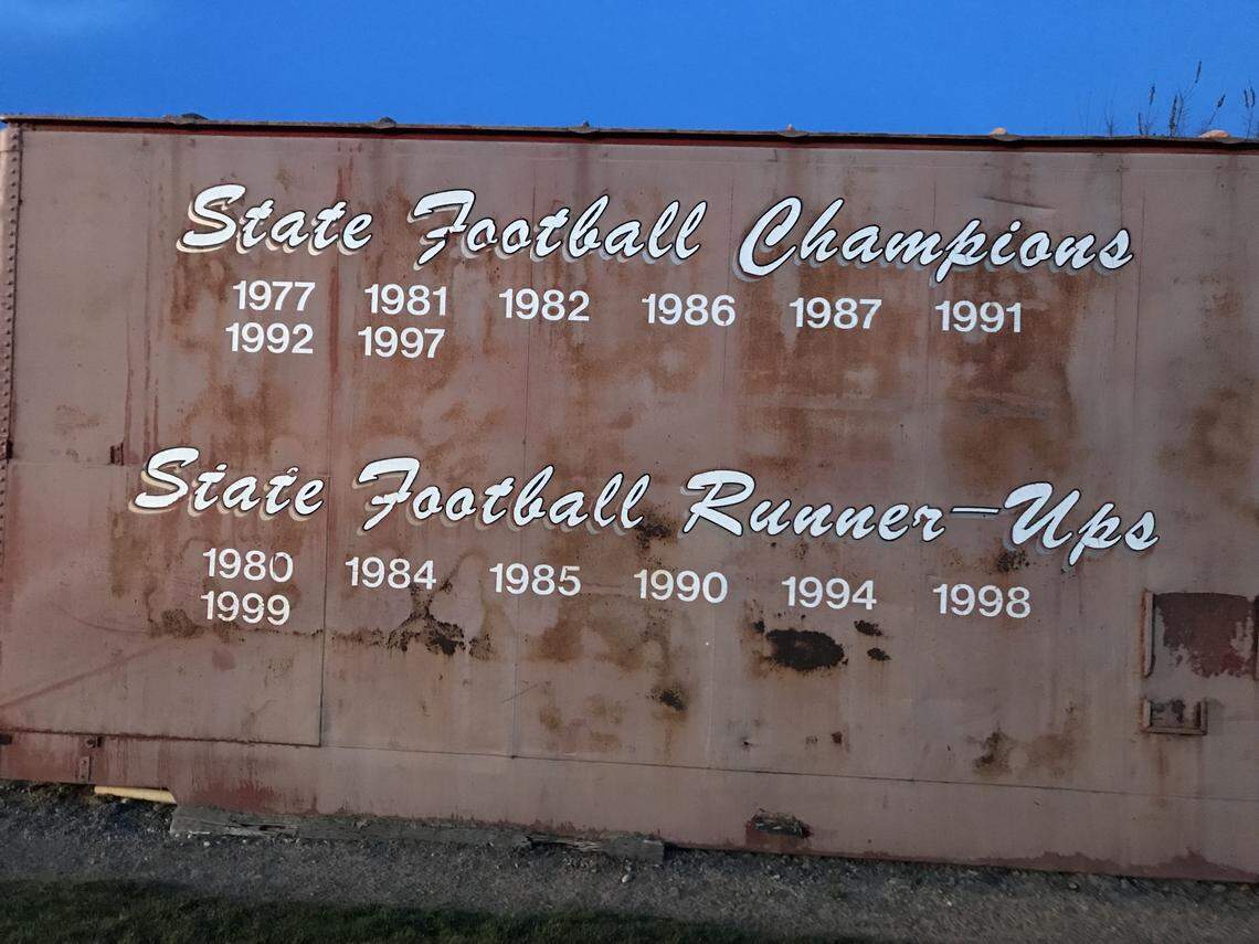 Several old boxcars sit adjacent to the football field in Homedale. One boxcar displays the program’s state championship and state runner-up seasons. Another lists the Trojans’ league titles.