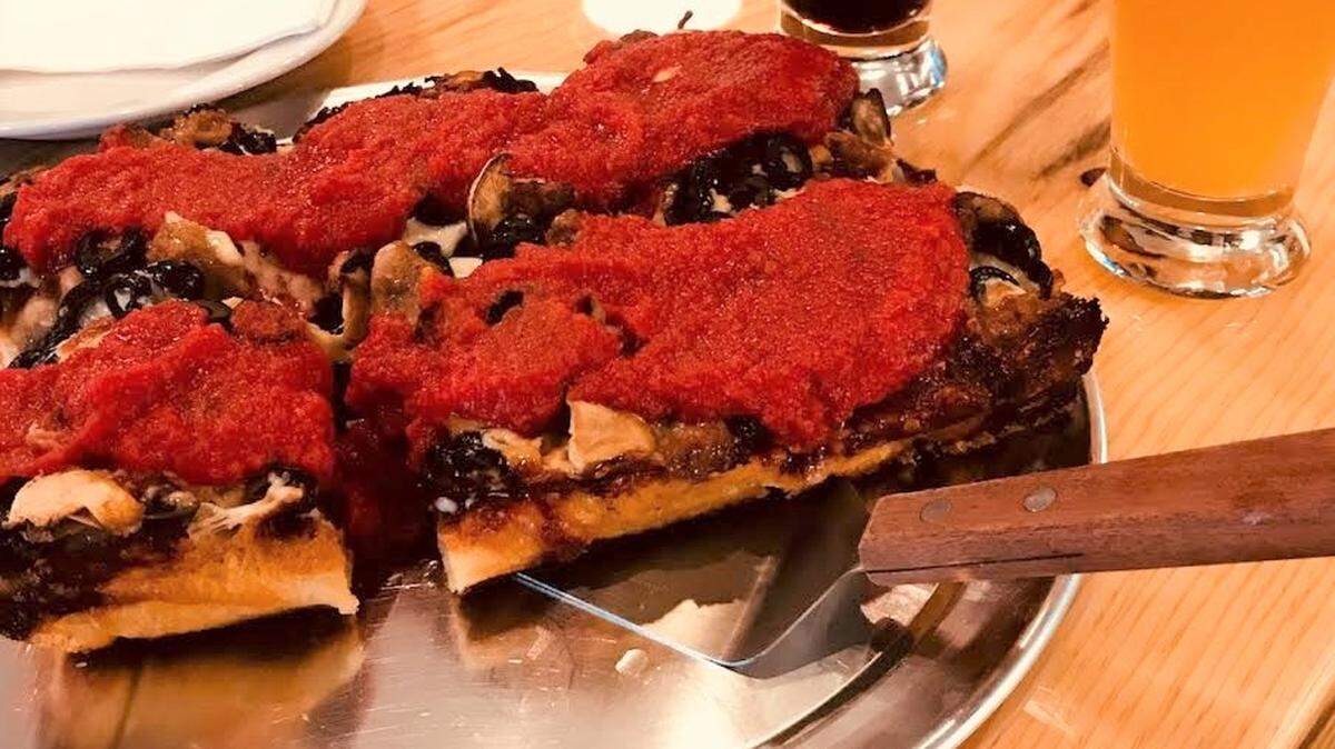 The Detroiter ($11/$21) comes with smoked pepperoni under the cheese and natural casing pepperoni on top — along with a pile of red sauce.