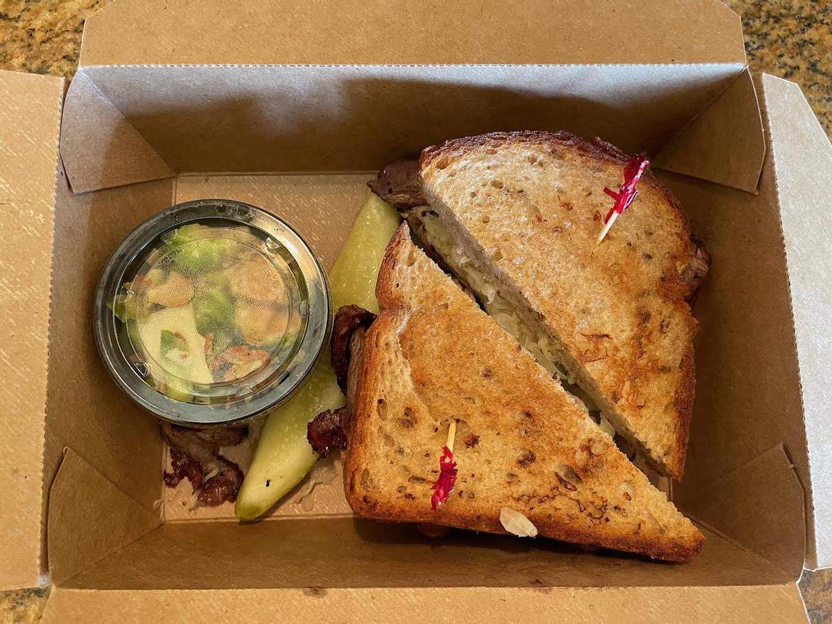 The Reuben ($15) comes with a small side and a pickle slice.