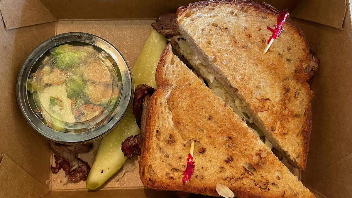 The Reuben ($15) comes with a small side and a pickle slice.