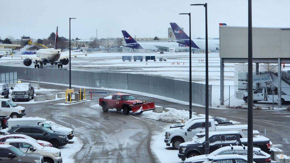 A commercial flight taxis ahead of takeoff during last week’s winter storm at the Boise Airport, on Dec. 23, 2022.